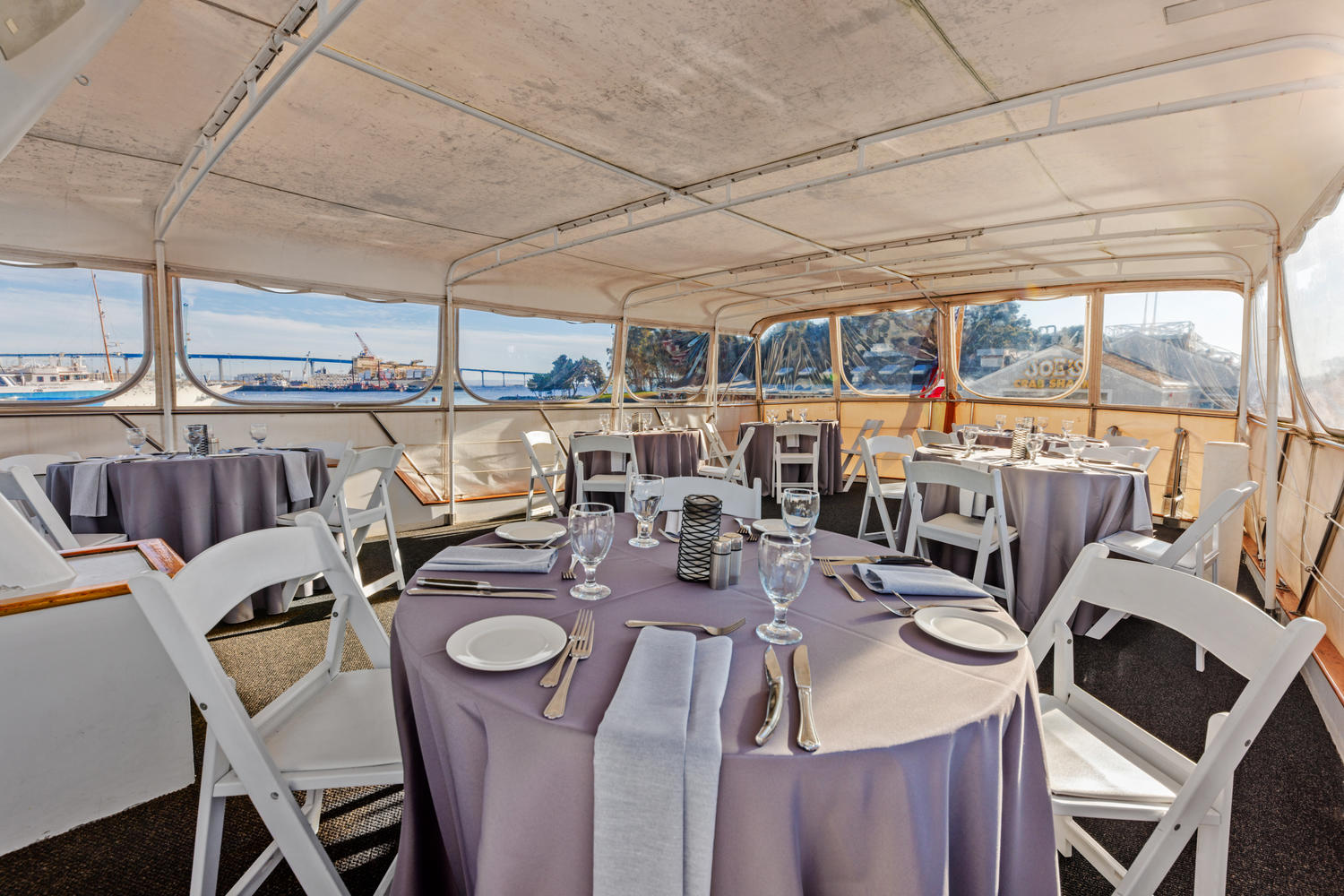 Top Deck – Forward View | Set for dining with open-air views.