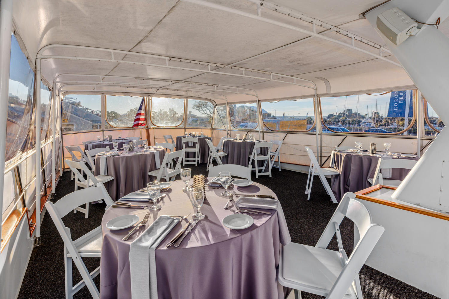 Top Deck – Aft View | Elegant dining with a backdrop of the horizon.