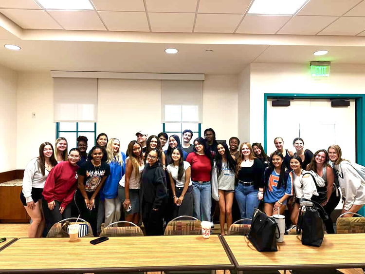 Large group of students smiling together at the SDSU Marketing and Communications College Speak on ZEST Project