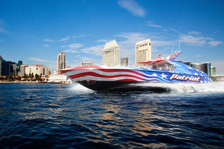 speed boat with backdrop of san diego skyline