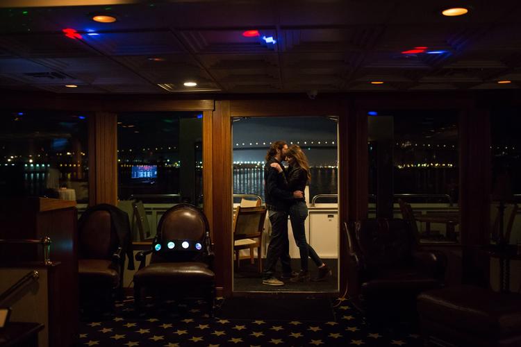 Couple steals a quiet moment during rehearsal dinner cruise