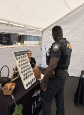 Police officer speaks with a woman at the Maritime Institute Career Fair
