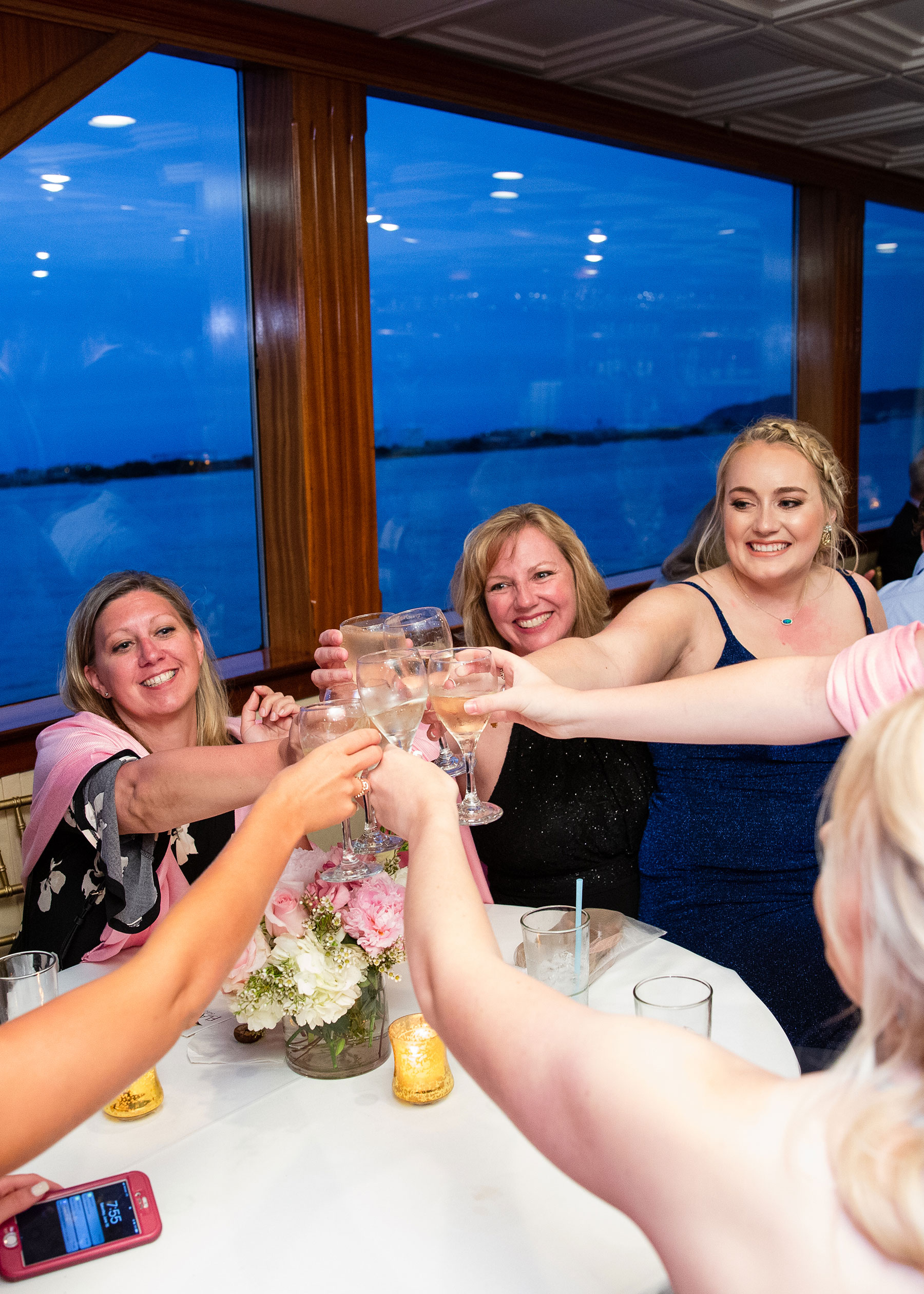 Rehearsal dinner guest being served dinner on a Flagship luxury yacht